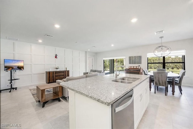 4969 Seton St, Ave Maria, FL 34142 - kitchen with dishwasher, a sink, a center island with sink, light stone counters, and recessed lighting