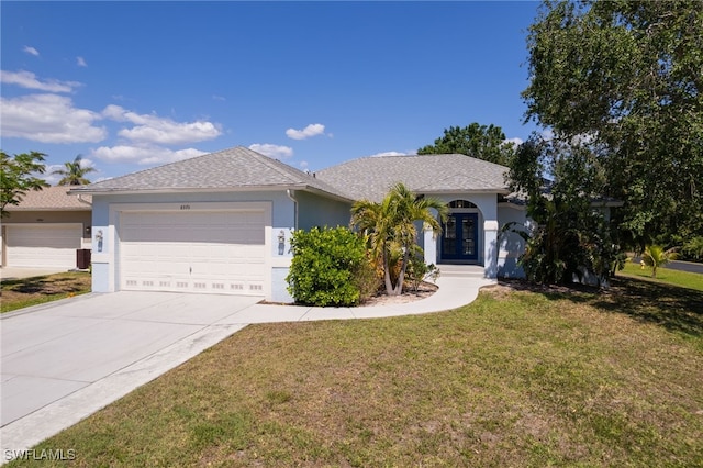 8970 Woodgate Manor Ct, Fort Myers, FL 33908 - ranch-style home with stucco siding, a garage, a front yard, and concrete driveway