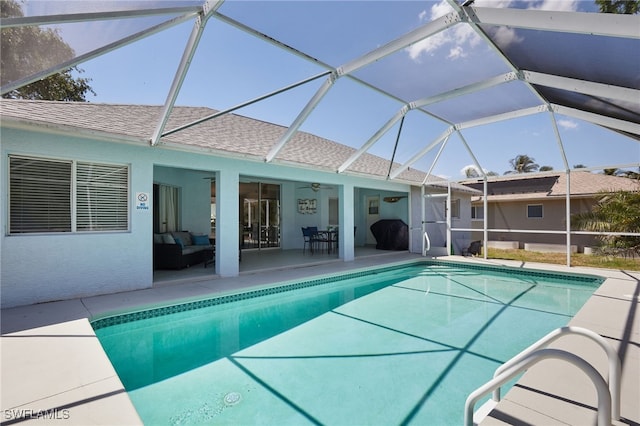 8970 Woodgate Manor Ct, Fort Myers, FL 33908 - swimming pool featuring a patio area, a ceiling fan, an outdoor hangout area, and glass enclosure