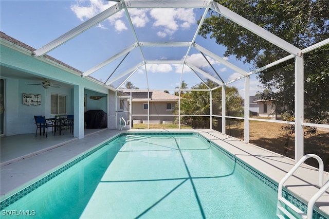 8970 Woodgate Manor Ct, Fort Myers, FL 33908 - swimming pool featuring ceiling fan, a patio, and glass enclosure