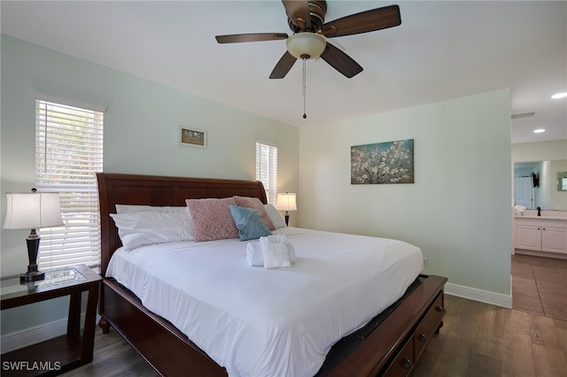 8970 Woodgate Manor Ct, Fort Myers, FL 33908 - bedroom featuring baseboards, wood finished floors, ensuite bath, a ceiling fan, and recessed lighting