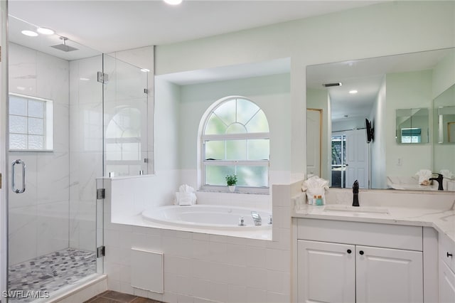 8970 Woodgate Manor Ct, Fort Myers, FL 33908 - full bathroom featuring a shower stall, a bath, vanity, and recessed lighting