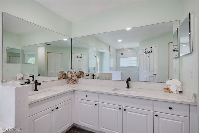 8970 Woodgate Manor Ct, Fort Myers, FL 33908 - full bathroom featuring a stall shower and double vanity