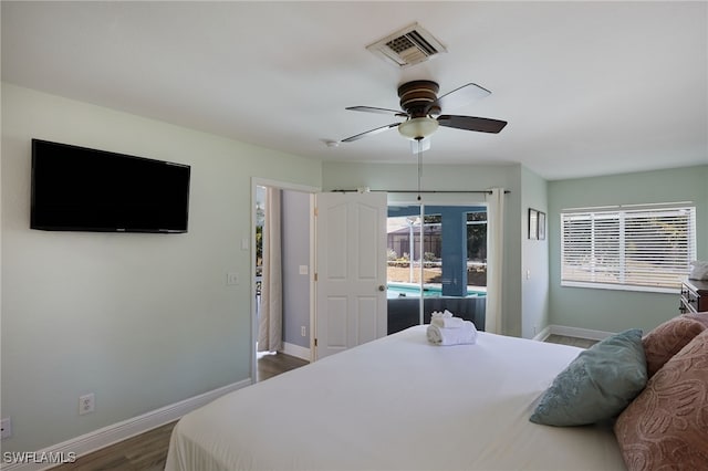 8970 Woodgate Manor Ct, Fort Myers, FL 33908 - bedroom featuring baseboards, dark wood-style flooring, and a ceiling fan