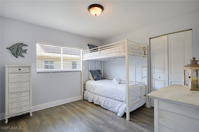 8970 Woodgate Manor Ct, Fort Myers, FL 33908 - bedroom featuring wood finished floors, baseboards, and a closet