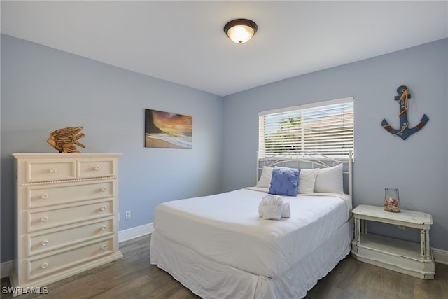 8970 Woodgate Manor Ct, Fort Myers, FL 33908 - bedroom with baseboards and dark wood-style floors