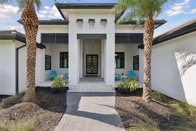 15392 Old Pine Ct, Fort Myers, FL 33912 - entrance to property featuring covered porch and stucco siding