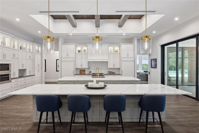15392 Old Pine Ct, Fort Myers, FL 33912 - kitchen with a large island, recessed lighting, backsplash, dark wood finished floors, and white cabinetry