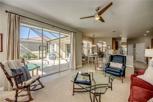 16112 Cutters Ct, Fort Myers, FL 33908 - living area featuring a ceiling fan, a sunroom, baseboards, arched walkways, and recessed lighting