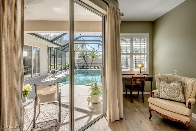 16112 Cutters Ct, Fort Myers, FL 33908 - doorway to outside featuring a sunroom and wood finished floors