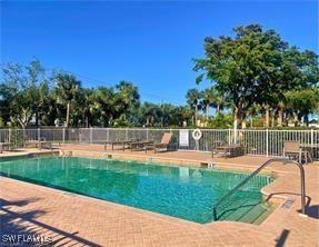 16112 Cutters Ct, Fort Myers, FL 33908 - community pool with fence and a patio area