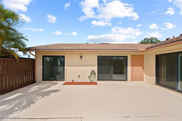 17307 Timber Oak Ln, Fort Myers, FL 33908 - back of house with stucco siding and a patio