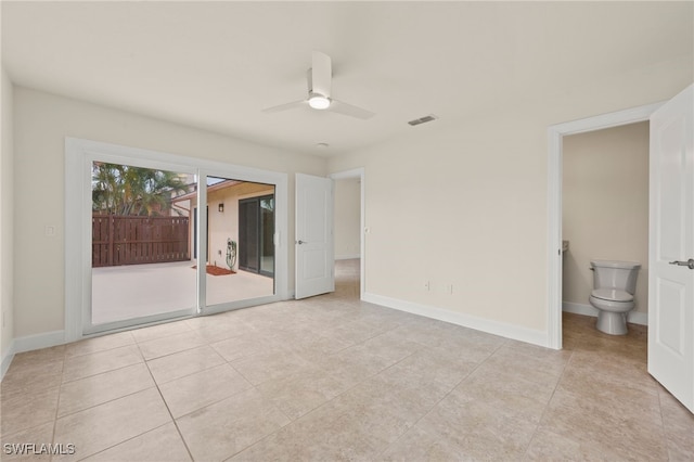 17307 Timber Oak Ln, Fort Myers, FL 33908 - unfurnished bedroom featuring access to outside, light tile patterned floors, baseboards, and connected bathroom