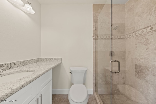 17307 Timber Oak Ln, Fort Myers, FL 33908 - bathroom with a stall shower, vanity, toilet, baseboards, and tile patterned flooring