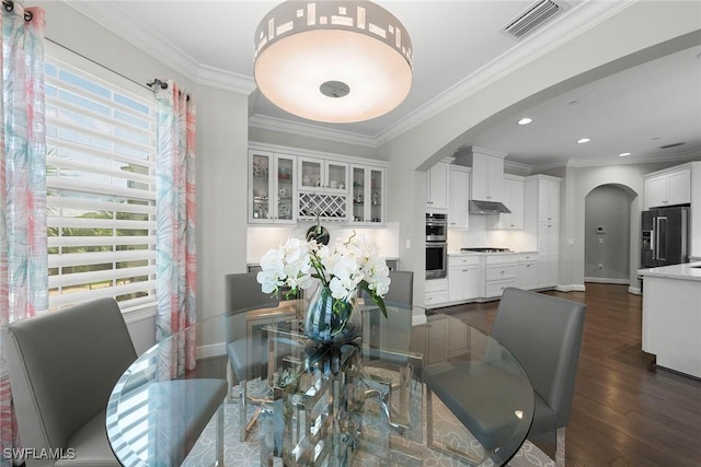 4750 Via Del Corso Ln Unit 201, Bonita Springs, FL 34134 - dining area with arched walkways, dark wood-type flooring, baseboards, ornamental molding, and recessed lighting
