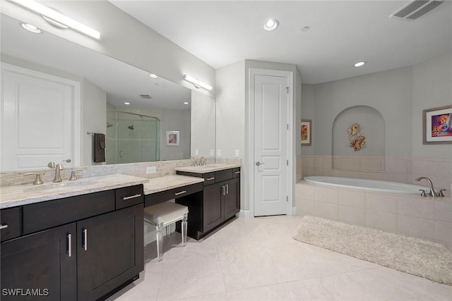 4750 Via Del Corso Ln Unit 201, Bonita Springs, FL 34134 - full bathroom featuring a stall shower, vanity, a bath, tile patterned flooring, and recessed lighting