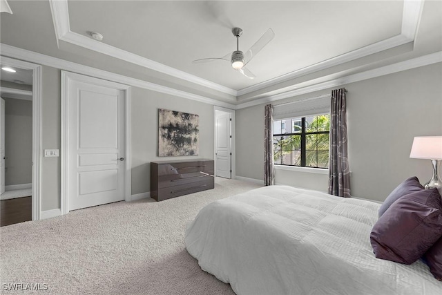 4750 Via Del Corso Ln Unit 201, Bonita Springs, FL 34134 - bedroom with a tray ceiling, ornamental molding, carpet flooring, ceiling fan, and baseboards