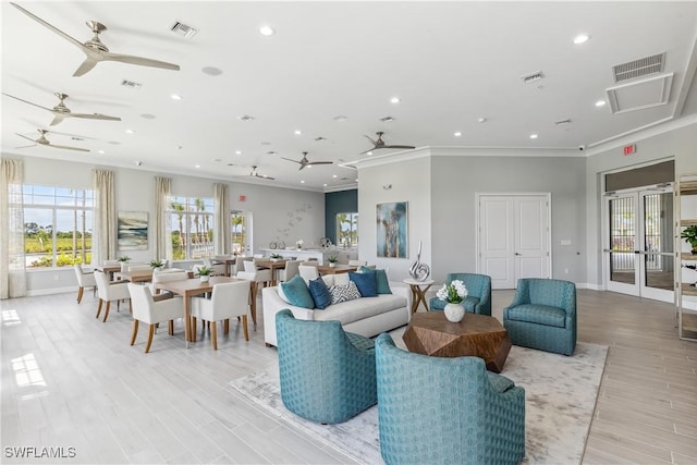 16811 Elkhorn Coral Dr, North Fort Myers, FL 33903 - living area featuring a ceiling fan, ornamental molding, french doors, recessed lighting, and light wood finished floors