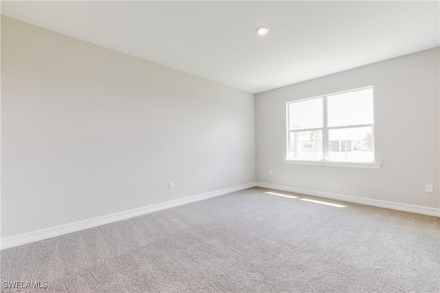 16811 Elkhorn Coral Dr, North Fort Myers, FL 33903 - carpeted spare room with baseboards