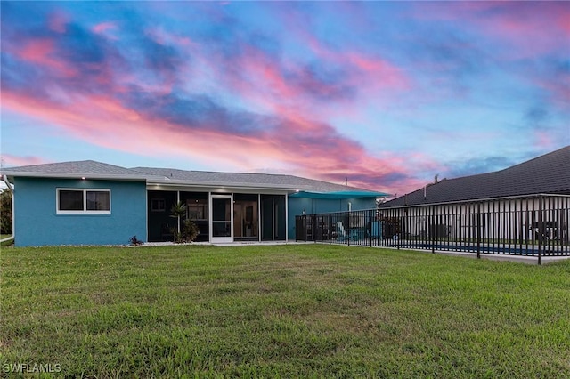 1401 SE 36th Ter, Cape Coral, FL 33904 - rear view of house featuring a sunroom and stucco siding