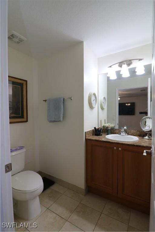 20321 Estero Gardens Cir Unit 108, Estero, FL 33928 - bathroom featuring tile patterned floors, vanity, toilet, and baseboards