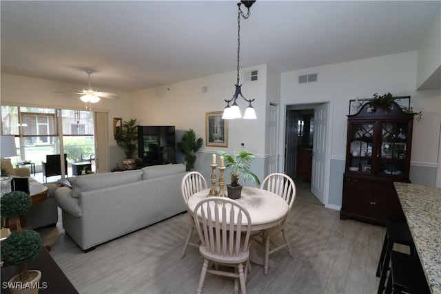 20321 Estero Gardens Cir Unit 108, Estero, FL 33928 - dining room featuring light wood finished floors and a ceiling fan