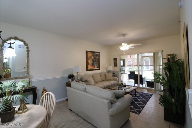 20321 Estero Gardens Cir Unit 108, Estero, FL 33928 - living room with light wood-style floors and a ceiling fan