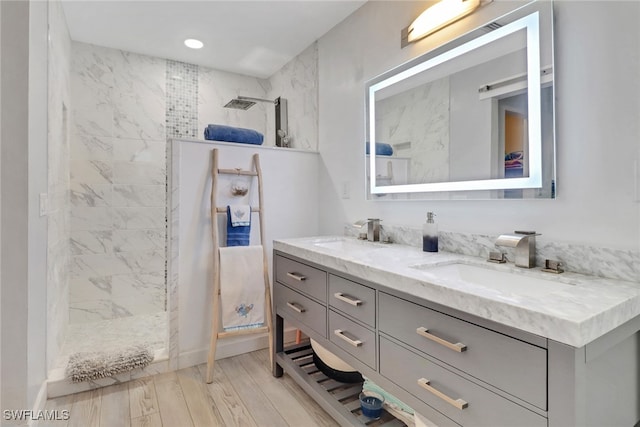 940 Golden Gate Blvd W, Naples, FL 34120 - bathroom featuring double vanity, a walk in shower, wood finished floors, and recessed lighting