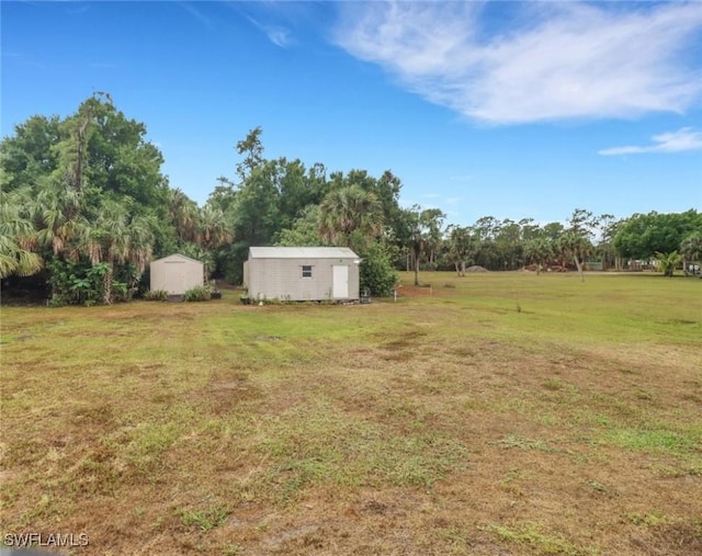 940 Golden Gate Blvd W, Naples, FL 34120 - view of green lawn with a shed and an outdoor structure