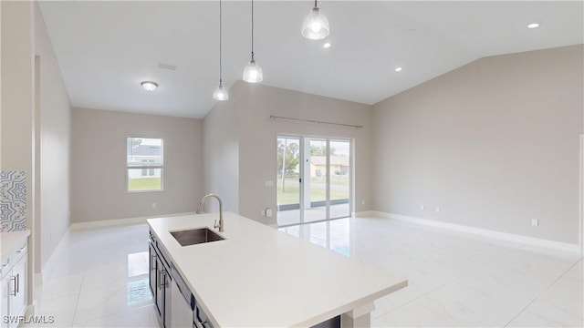 2505 4th St SW, Lehigh Acres, FL 33976 - kitchen featuring a sink, open floor plan, light countertops, vaulted ceiling, and hanging light fixtures