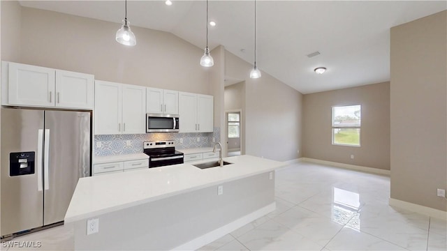 2505 4th St SW, Lehigh Acres, FL 33976 - kitchen with appliances with stainless steel finishes, a sink, tasteful backsplash, white cabinets, and light marble finish floors
