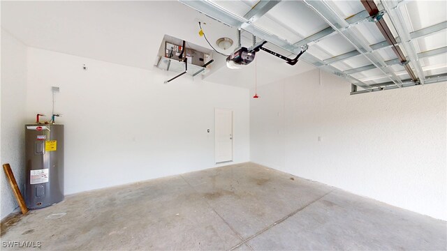 2505 4th St SW, Lehigh Acres, FL 33976 - garage featuring electric water heater and a garage door opener