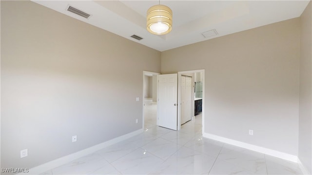 2505 4th St SW, Lehigh Acres, FL 33976 - unfurnished room with baseboards and light marble finish flooring