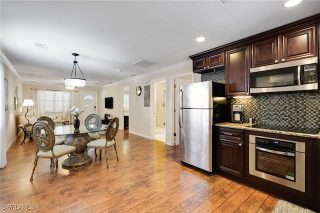 kitchen with stainless steel appliances, ornamental molding, baseboards, dark brown cabinetry, and light wood-style flooring