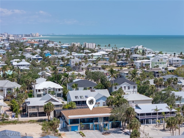 aerial view of residential area featuring a nearby body of water
