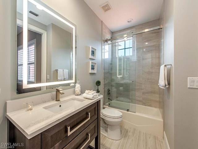 2452 Terra Verde Ln Unit 2452, Naples, FL 34105 - full bathroom with toilet, vanity, and shower / bath combination with glass door