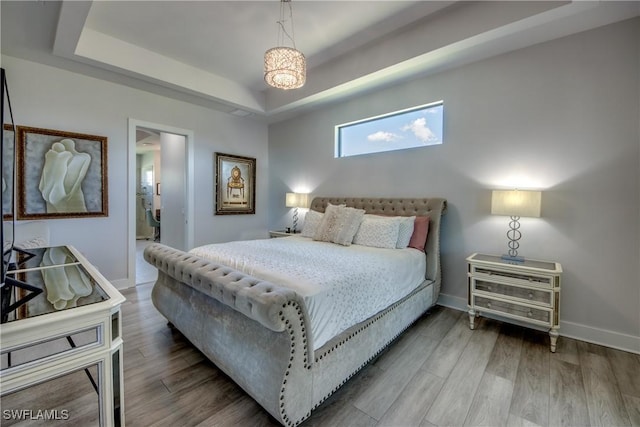 3726 Ceitus Pkwy, Cape Coral, FL 33991 - bedroom with a tray ceiling, wood finished floors, and baseboards