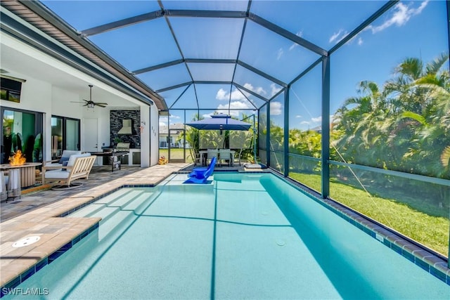 3726 Ceitus Pkwy, Cape Coral, FL 33991 - outdoor pool featuring a patio, a ceiling fan, glass enclosure, and an outdoor fire pit
