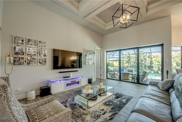 3726 Ceitus Pkwy, Cape Coral, FL 33991 - living area featuring a towering ceiling, coffered ceiling, a chandelier, beam ceiling, and wood finished floors