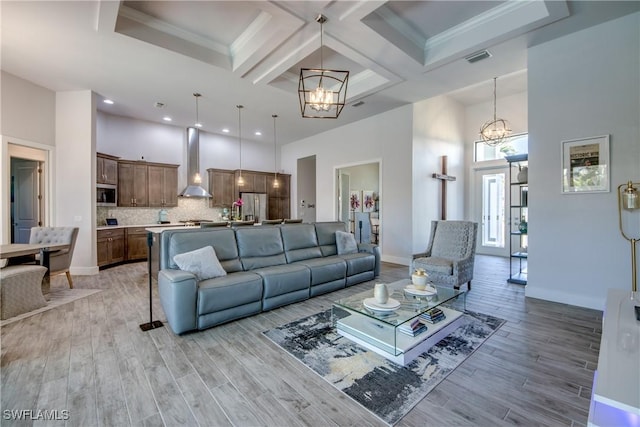 3726 Ceitus Pkwy, Cape Coral, FL 33991 - living room with a chandelier, a towering ceiling, light wood-type flooring, recessed lighting, and coffered ceiling