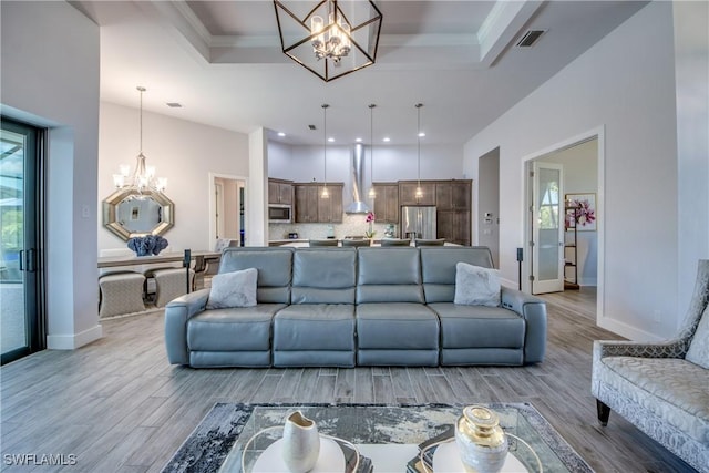 3726 Ceitus Pkwy, Cape Coral, FL 33991 - living room featuring a chandelier, a tray ceiling, light wood-type flooring, baseboards, and recessed lighting