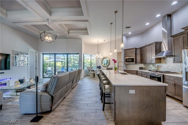 3726 Ceitus Pkwy, Cape Coral, FL 33991 - kitchen featuring a chandelier, a sink, appliances with stainless steel finishes, a towering ceiling, and open floor plan
