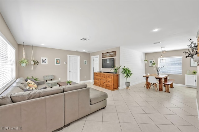 5397 25th Ave SW, Naples, FL 34116 - living room with baseboards, light tile patterned floors, and recessed lighting
