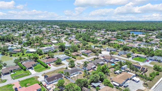 5397 25th Ave SW, Naples, FL 34116 - aerial overview of property's location with nearby suburban area, a nearby body of water, and a forest