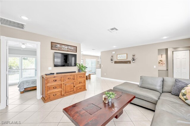5397 25th Ave SW, Naples, FL 34116 - living room featuring plenty of natural light, light tile patterned flooring, ceiling fan, recessed lighting, and baseboards