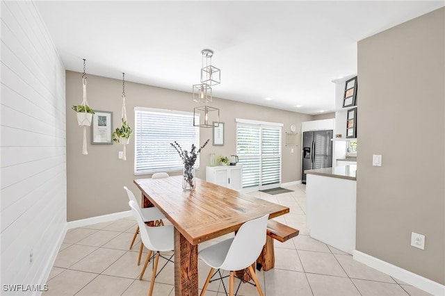 5397 25th Ave SW, Naples, FL 34116 - dining space featuring light tile patterned floors and baseboards