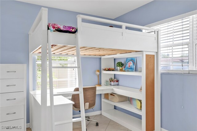 5397 25th Ave SW, Naples, FL 34116 - tiled bedroom with a desk, multiple windows, and baseboards