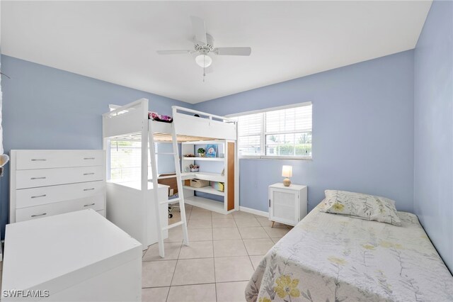5397 25th Ave SW, Naples, FL 34116 - bedroom with multiple windows, light tile patterned floors, baseboards, and a desk