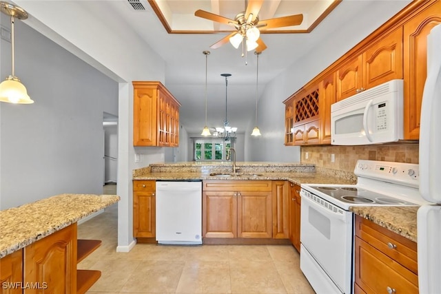 3450 Frosty Way Unit 5210, Naples, FL 34112 - kitchen with white appliances, a sink, a ceiling fan, and brown cabinets