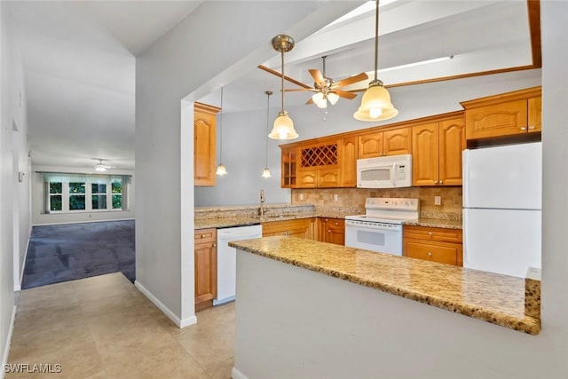 3450 Frosty Way Unit 5210, Naples, FL 34112 - kitchen featuring white appliances, ceiling fan, a sink, and light stone countertops
